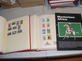 Two albums containing stamps relating to Africa, C