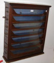 An unusual Victorian seven drawer wall mounted dis