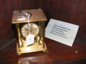 A brass mantel clock