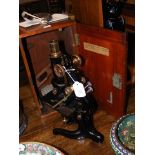 A Watson and Sons microscope in fitted carrying ca
