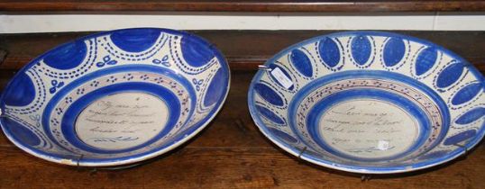 Two early Delft pottery chargers with writing to t