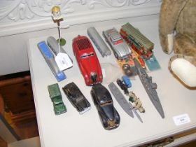 A collection of vintage toy cars, including Schuco