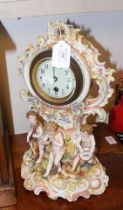 A decorative antique ceramic mantel clock - 36cms