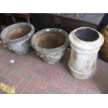 A pair of weathered garden pots, together with an