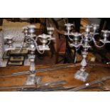 A pair of five branch silver plated candelabra