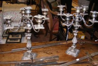 A pair of five branch silver plated candelabra