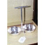 A Christopher Dresser style silver plated cruet stand wi