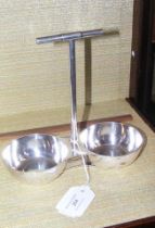 A Christopher Dresser style silver plated cruet stand wi