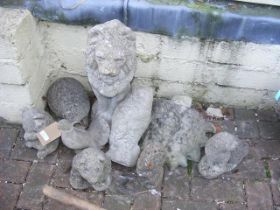 Assorted stone statues, including Lion