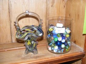 A jar of glass marbles and a Murano glass basket v