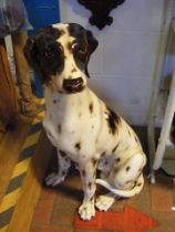 A life size ceramic dog