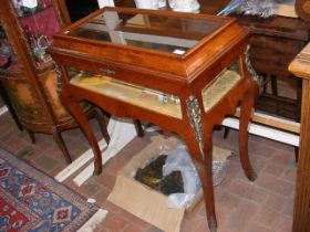 A French style display cabinet on cabriole support