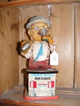 A vintage automated Charlie Weaver Bartender toy