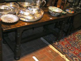 An antique oak refectory table on turned stretcher