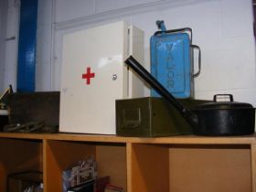 A hanging metal wall cabinet, together with petrol
