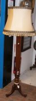 A reeded mahogany standard lamp