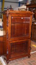 A 19th century French display cabinet with glazed