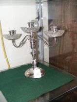 A 24cm high silver three branch candelabra with gl