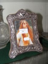 A silver Art Nouveau style photo frame - 21cm x 16