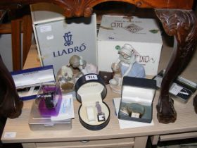 Lladro and Nao figures, together with wrist watche