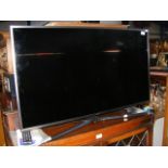 A Samsung Model UE40MU6470U 40 inch TV - complete