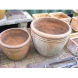 Two large terracotta garden plant pots