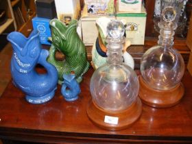Two bulbous glass decanters, together with Dartmou