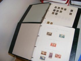 Two albums containing a large collection of stamps