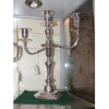 A silver three branch candelabra - 38cms high