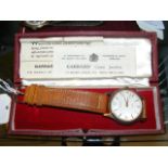 A 9ct gold gents Garrard wrist watch in original G