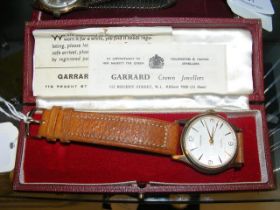 A 9ct gold gents Garrard wrist watch in original G