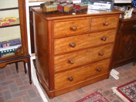 A Victorian mahogany cap top chest of drawers