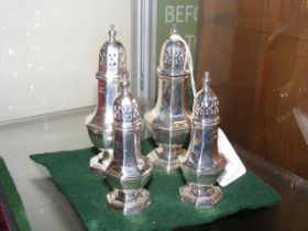 A pair of 11cm high silver pepperettes together wi
