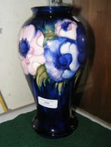 A 25cm high Moorcroft Pottery vase with signature