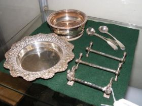 A circular silver pin tray, knife rests etc.