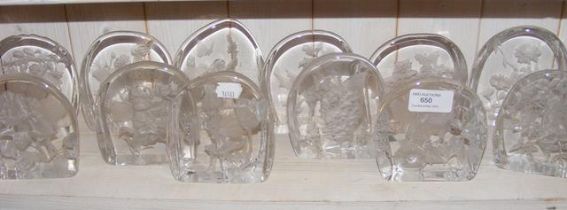 A collection of Dartington glass ornaments depicti