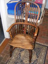 A 19th century stick back country armchair with cr