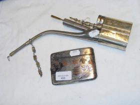 An Oriental silver cigarette case together with an