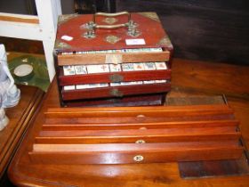 An antique Mah-jong set in fitted carrying case wi
