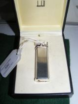 A boxed Dunhill lighter with booklet