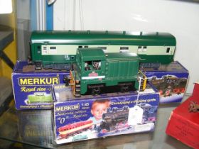 A boxed Merkur 0 gauge locomotive together with bo