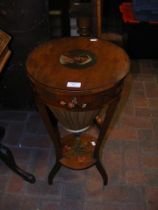 A 19th century satinwood circular workbox with pai