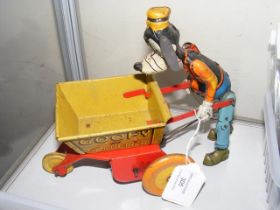 A tin plate 'Goofy the Gardener' by Marx Toys - 18c