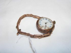 A ladies rose gold wrist watch with enamel dial