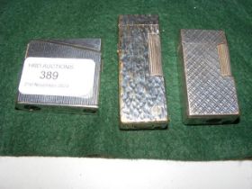 Three collectable Dunhill and other lighters