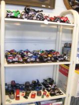 Three shelves of collectable Maisto model motorcyc