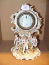 A continental porcelain clock with cherub group be