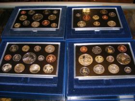 Four Royal Mint commemorative coin sets 2004, 2005