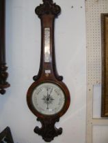 A Victorian walnut barometer/thermometer - 110cm