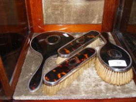 A faux tortoiseshell dressing table set